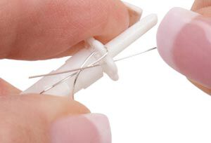 Wire being looped on the wire knitter